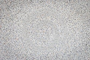 Bright grey pebble stone wall texture and background