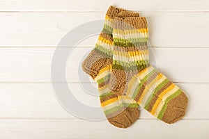 Bright handmade socks on background.