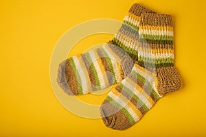 Bright handmade socks on background.