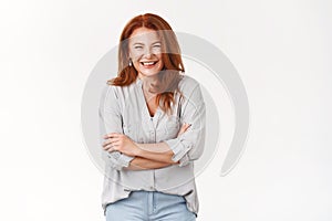 Bright happy successful redhead middle-aged woman loved caring mother laughing funny grandchild cross arms chest