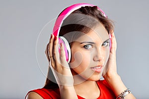 Bright headphones accentuate her musical moment