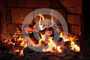Bright heat and hot coals in the fireplace. Graphic of fire.