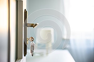 Bright Hi photo of keys in the door`s lock. Relocation, housing estate concept. New construction property, white raw scandinavian