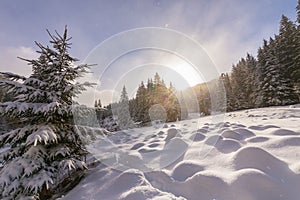 Bright high alpine winter scenery, with fresh snow and mist, in the Alps