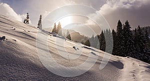 Bright high alpine winter scenery, with fresh snow and mist, in the Alps