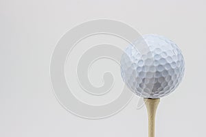 A bright, high-key portrait of a golf ball.