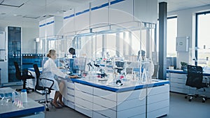 Bright High-Tech Medical Science Laboratory with Diverse Team of Professional Research Scientists