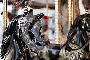 Bright horses carousel detail on a merry-go-round