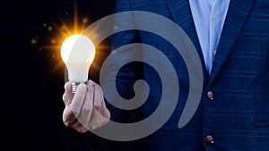 Bright idea in hand Business man,Hands holding light bulb for concept new idea concept with innovation and inspiration,technology