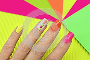Bright illuminated multicolored manicure.