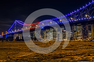 Bright illumination of city bridge in night