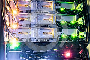 A bright indication shines on the network interfaces of the Internet routers. Powerful server equipment works in the data center.