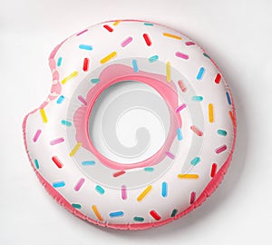 Bright inflatable donut on white background