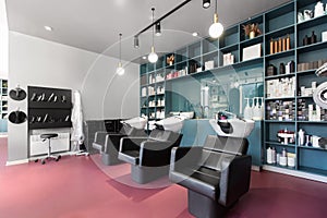 Bright interior of a beauty salon with armchairs for hairdresser procedures