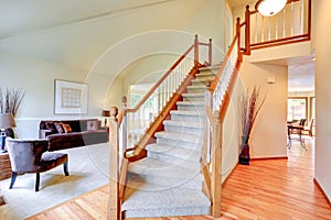 Bright ivory house interior with high vaulted ceiling