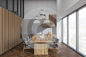 Bright kitchen room interior with dining table, six armchairs