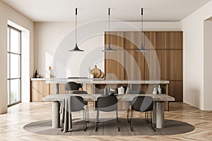 Bright kitchen room interior with dining table, six chairs