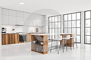 Bright kitchen room interior with table and three bar stool