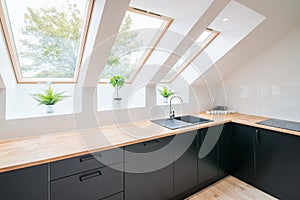 Bright kitchen with slanted ceiling.