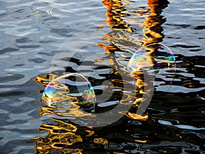 Soap bubbles on the water surface