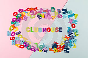 Bright letters Clubhouse. New trend. Social application on on the smartphone. Flat lay