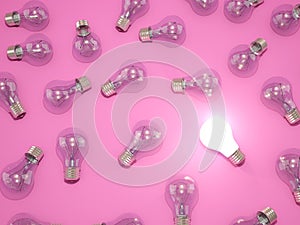 Bright light bulb on pink background