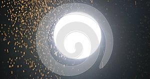 Bright Light and Falling Particles in the Night