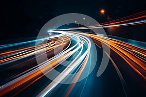 Bright light trails bending on a highway