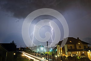 Bright lightnings over the city at the night