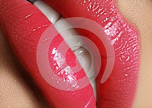 bright lips. Close-up Lips with juicy pink Make-up. Fashion magenta Makeup. Macro Beauty. Augmentation Treatment