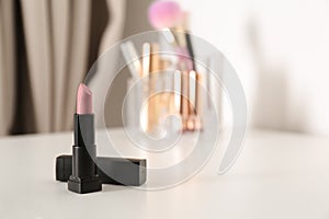 Bright lipstick on dressing table
