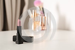 Bright lipstick on dressing table
