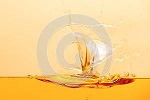 Bright liquid splash with drops isolated