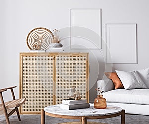 Bright living room design, poster mockup in white room interior with rattan furniture and minimal sofa, Scandinavian style