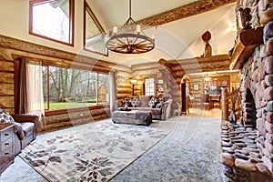 Bright Living room interior in American log cabin house.