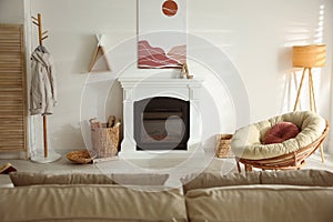 Bright living room interior with fireplace and papasan chair