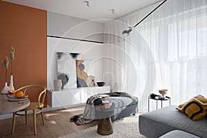 Bright living room with orange wall