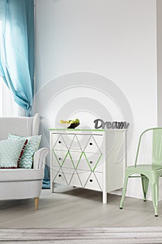 Bright living room with white chest of drawers