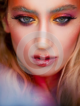 Bright makeup and face art, close-up portrait. Creative makeup,