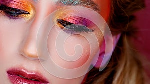 Bright makeup and face art, close-up portrait, girl with closed eyes. Creative makeup,