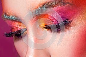 Bright makeup and face art, close-up portrait, girl with closed eyes. Creative makeup,