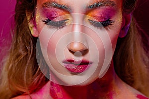 Bright makeup and face art, close-up portrait, girl with closed eyes. Creative makeup,