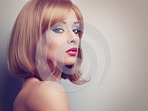 Bright makeup profile of beautiful woman with blond short hair l