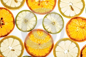 Bright mandarin, lemon and lime slices on white