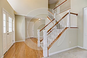 Bright Midwest Foyer with staircase.