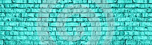 Bright mint color brick wall texture. Light aquamarine old shabby masonry. Teal brickwork wide background