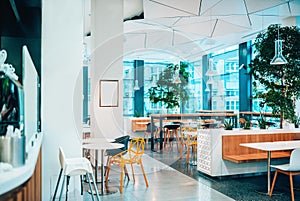 Bright and modern interior of cafe restaurant with copy space.