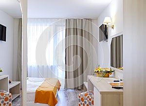 Bright and modern interior of hotel double room 1