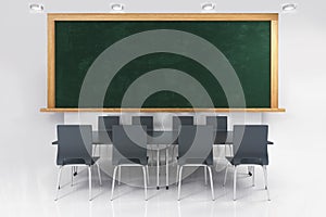 Bright modern lecture room with blackboard