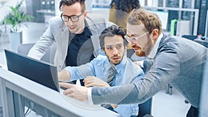 In Bright Modern Office: Businessman Sitting and Working at His Desktop Computer, Project Manager